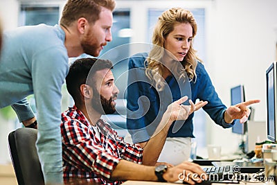 Software engineers working on project and programming in company Stock Photo