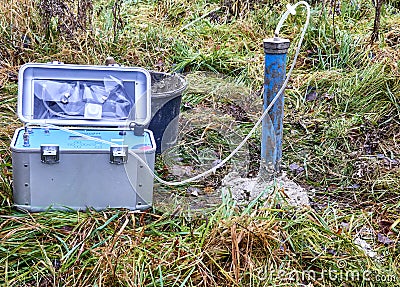 Soil air level with connected soil air pump with sensors for measuring the soil gases methane, carbon dioxide and oxygen Editorial Stock Photo