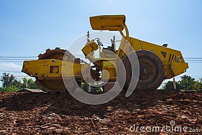 The soil compactor is in the work area.Road roller equipped with padfoot drum Stock Photo