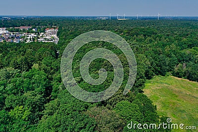 Soil heaps and material for soil recycling at the edge of a sand pit in Germany, taken from the air with the drone flight Stock Photo