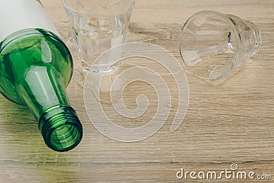 A soju bottle with two glasses on the wooden table Stock Photo