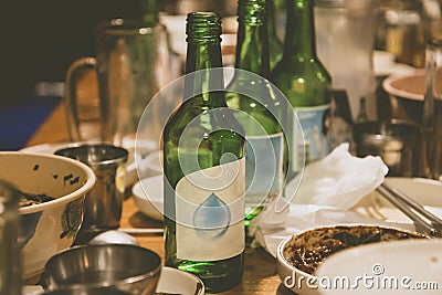 Soju bottles and korean side dishes at the party in korea Stock Photo