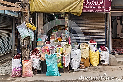 Shop selling dried herbs and chili peppers in Srinagar Editorial Stock Photo