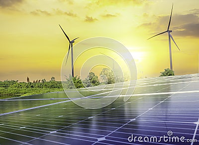 Solar cell panels and wind turbines in sunset sky for alternatively power generator source Stock Photo