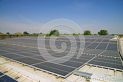 Solar cells on the roof of a factory Stock Photo