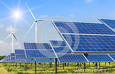 Solar cells and wind turbines generating electricity in power station alternative renewable energy Stock Photo