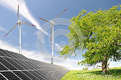 Solar energy panels and wind turbine Stock Photo