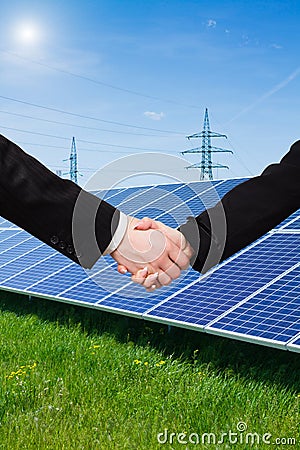Solar panel against high voltage towers Stock Photo