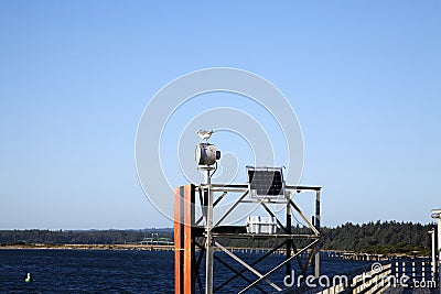 Solar Panel Navigational Aid Dock Seagull Blue Sky Stock Photo