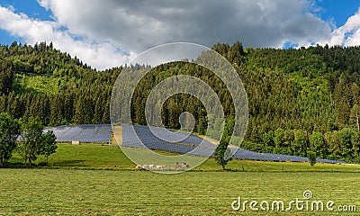 Solar panel power system in a countryside by the forest Stock Photo