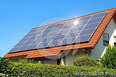 Solar panel on a red roof Stock Photo