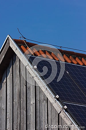 solar panel on rooftop on wooden facade Stock Photo