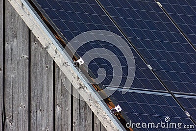 solar panel on rooftop on wooden facade Stock Photo