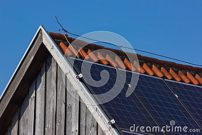 solar panel on rooftop on wooden facade Stock Photo