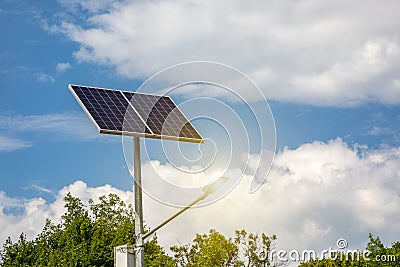 Solar panels above the highway to illuminate the road. Renewable energy with the help of the sun Stock Photo