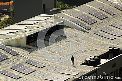 Solar panels being installed on the roof of delhi metro station Stock Photo