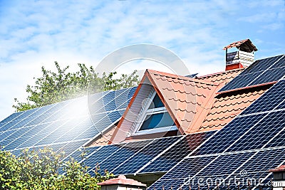 Solar panels, Close up shot of a solar panel array with blue sky, Solar panels on a roof for electric power generation Stock Photo