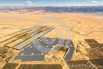 Solar panels farm energy panel Israel desert mountains from above aerial view Stock Photo