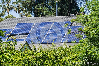 Solar panels installed on the rooftop of a house Stock Photo