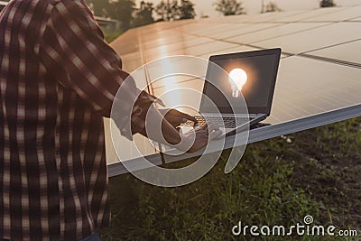 solar power plant Engineer surveying a solar farm Stock Photo