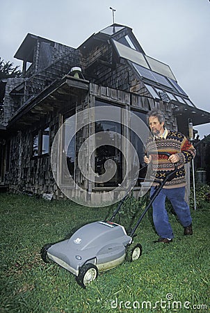 Solar powered lawnmower at an energy efficient home in Mendocino, CA Editorial Stock Photo
