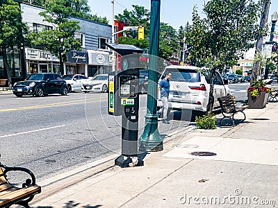 A solar powered paid parking station Editorial Stock Photo