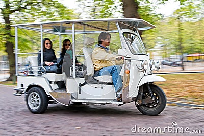 Solar powered tuc tuc at full speed Stock Photo