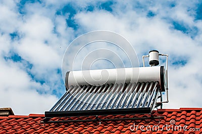 Solar water heater boiler on residentual house rooftop Stock Photo