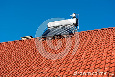 Solar water heater boiler on residentual house rooftop Stock Photo