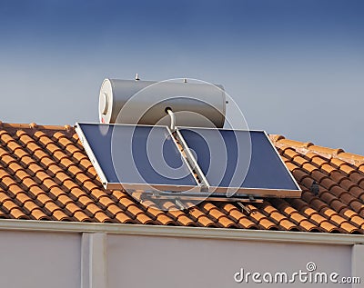 Solar water heater on roof of house Stock Photo