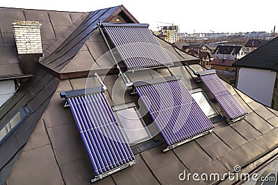 Solar water heating system on house roof. Hot water boiler, alternative ecological sun energy generator Stock Photo