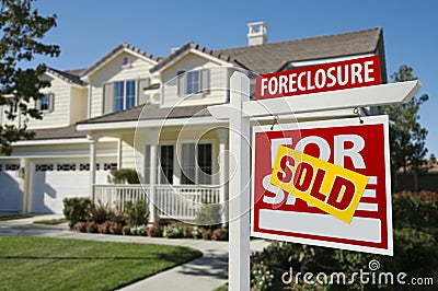 Sold Foreclosure Home For Sale Sign and House Stock Photo