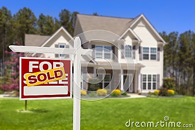 Sold Home For Sale Real Estate Sign and House Stock Photo