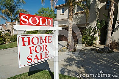 Sold Home For Sale Sign & Home Stock Photo