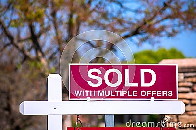 SOLD With Multiple Offers real estate sign near purchased house indicates hot seller`s market in the desired neighborhood Stock Photo