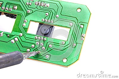 Soldering contacts on the chip.Circuit board with soldered contacts.Soldering and repair of chips. Stock Photo