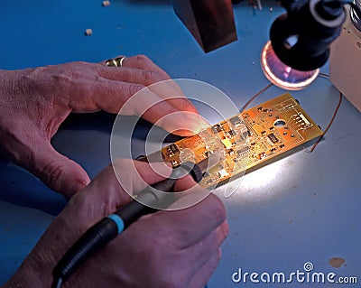 Soldering electronic components. Stock Photo