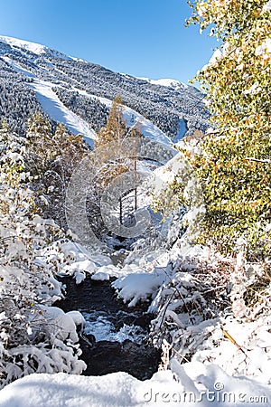 Soldeu, Canillo, Andorra on an autumn morning in its first snowfall of the season. Stock Photo