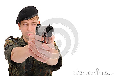 Soldier aiming with gun Stock Photo