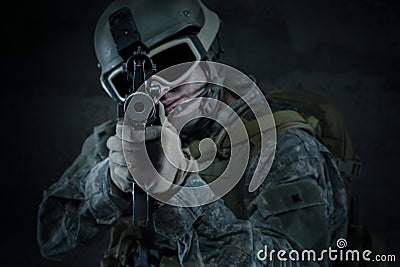 Soldier aiming a rifle at you Stock Photo