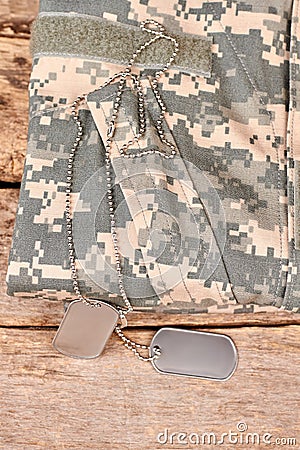 Soldier camouflage clothes and dog tags. Stock Photo