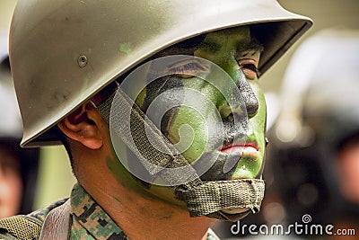 Soldier Face Painted In Green Editorial Stock Photo