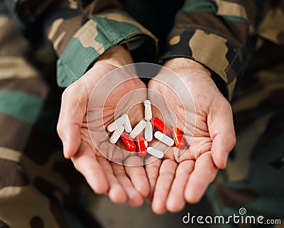 Soldier, hands and drugs from psychologist in therapy or person healing mental health with medication, medicine or pills Stock Photo