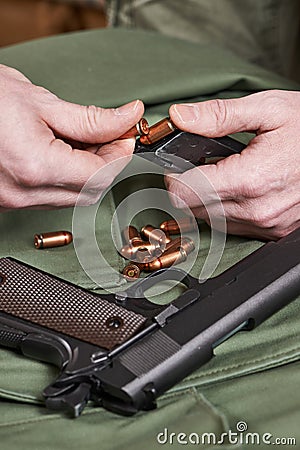 Soldier load ammo in clip Colt Stock Photo