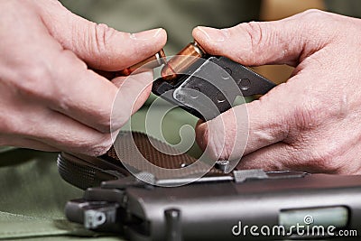 Soldier load ammo in clip Colt Stock Photo