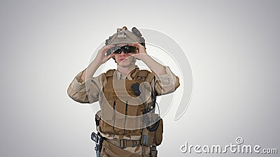 Soldier preparing tactical gear for action battle on gradient ba Stock Photo