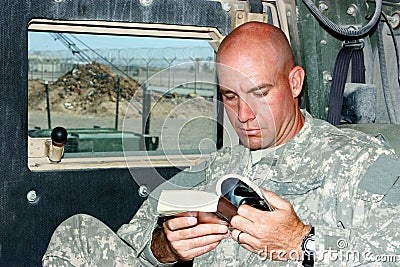 A soldier reading Stock Photo