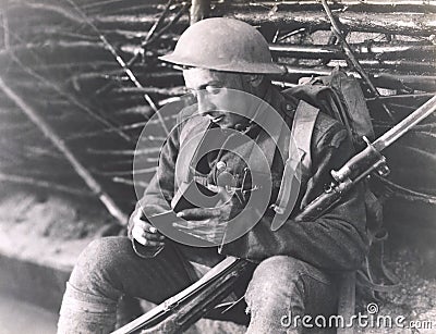 Soldier reading a book Stock Photo