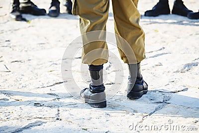 The soldier`s footwear of the Israeli army which is put on legs in clear sunny day Stock Photo