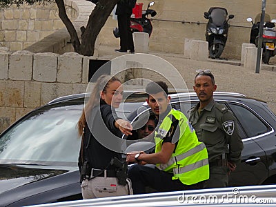 A soldier and a security guard at the Western Wall in Jerusalem Editorial Stock Photo
